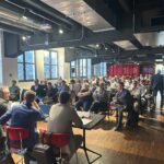 Pubblico seduto durante il talk introduttivo sull’importanza della direttiva NIS2 alla conferenza organizzata da CYBERTO.
